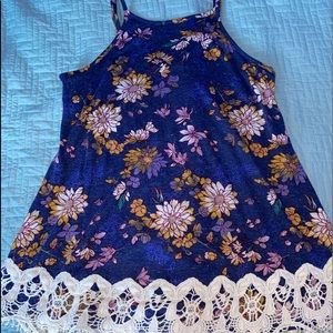 purple floral shirt with lace at the bottom